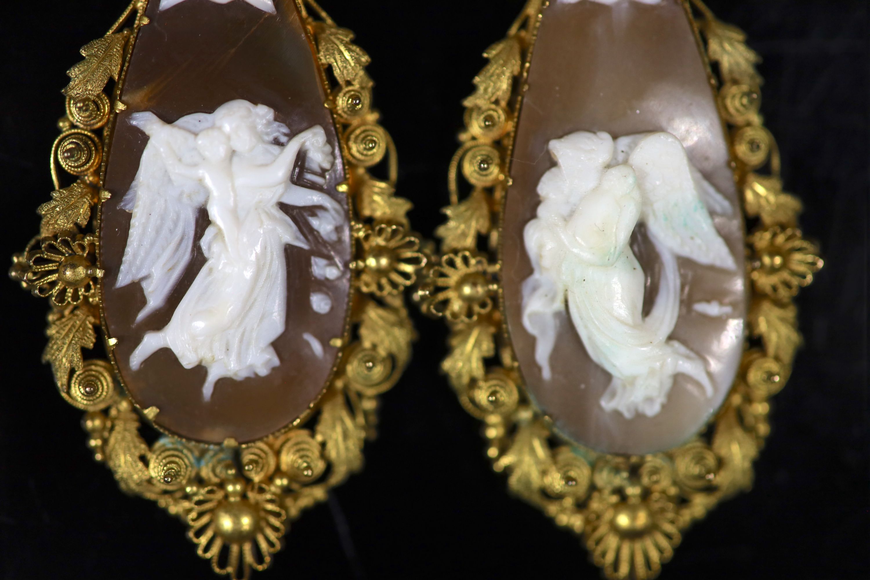 A pair of Victorian gold mounted cameo shell teardrop shaped drop earrings